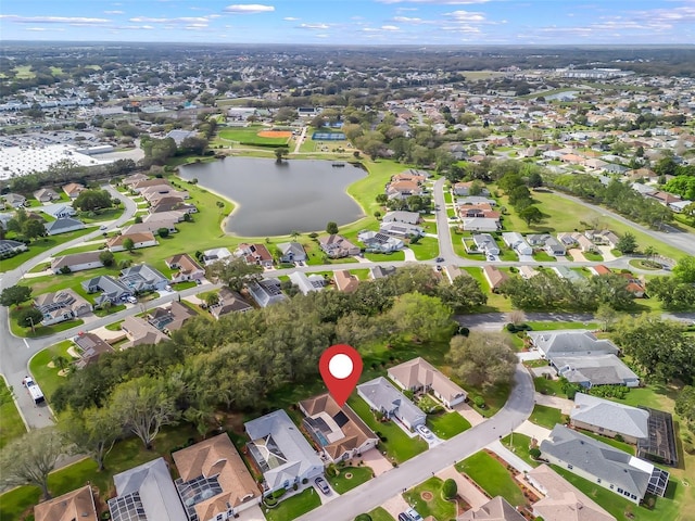 drone / aerial view featuring a residential view and a water view