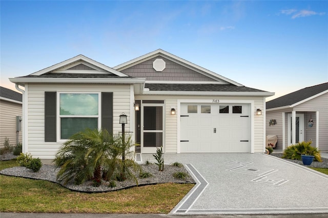 view of front of property featuring a garage and driveway