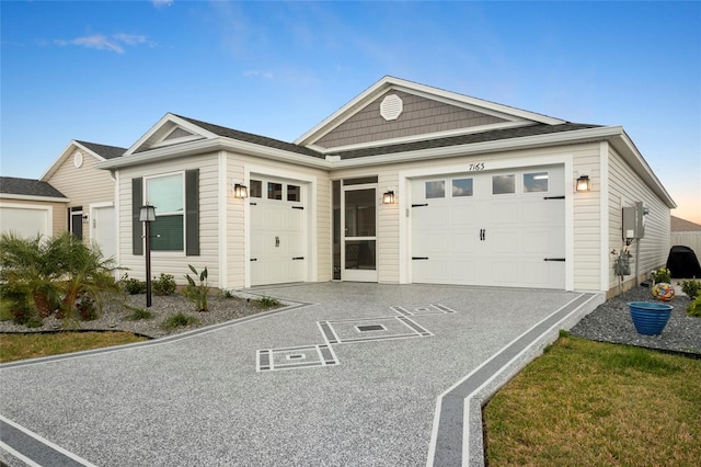 single story home with concrete driveway