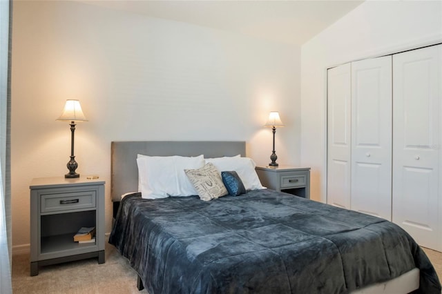 bedroom featuring light carpet and a closet