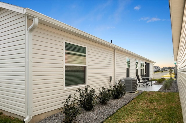 view of home's exterior featuring central AC and a patio area