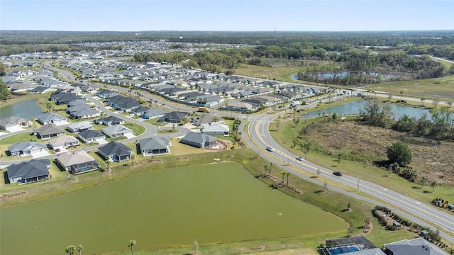 bird's eye view featuring a residential view and a water view