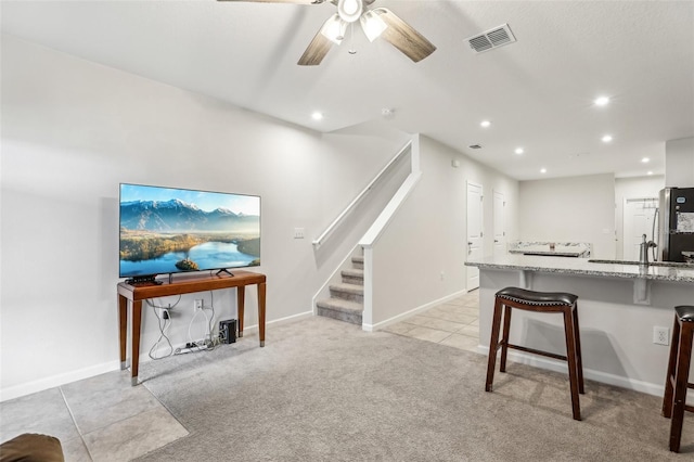 255 Blueberry Ln, Davenport, FL 33837 - living room featuring stairway, light tile patterned floors, ceiling fan, visible vents, and recessed lighting