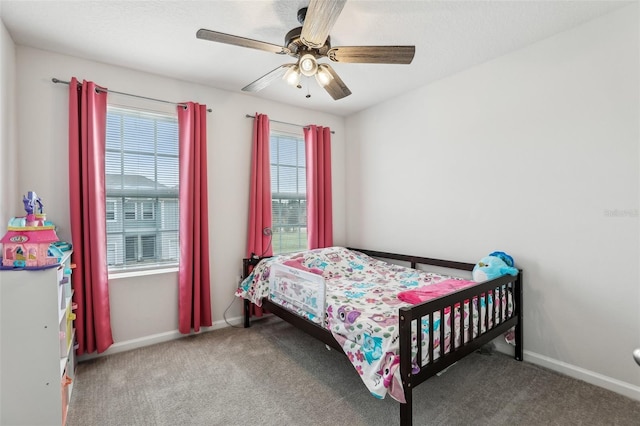 255 Blueberry Ln, Davenport, FL 33837 - carpeted bedroom with baseboards and a ceiling fan