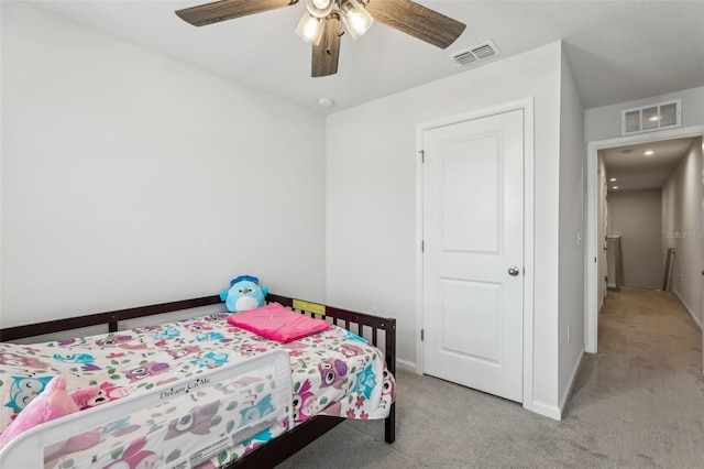 255 Blueberry Ln, Davenport, FL 33837 - bedroom with baseboards, visible vents, light colored carpet, and ceiling fan