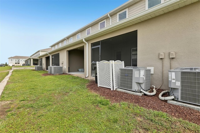 255 Blueberry Ln, Davenport, FL 33837 - back of property with central AC and stucco siding