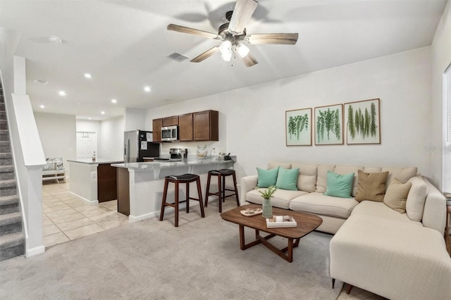 255 Blueberry Ln, Davenport, FL 33837 - living room featuring recessed lighting, visible vents, a ceiling fan, light tile patterned floors, and stairs