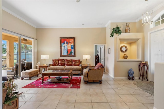 living area with light tile patterned floors, ornamental molding, a notable chandelier, and baseboards