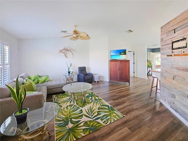 6106 Kittiwake Dr, Lakeland, FL 33809 - living area featuring visible vents, wood finished floors, a ceiling fan, and vaulted ceiling