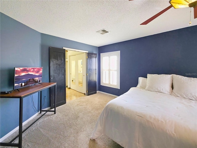 6106 Kittiwake Dr, Lakeland, FL 33809 - bedroom with visible vents, a ceiling fan, a textured ceiling, carpet floors, and baseboards