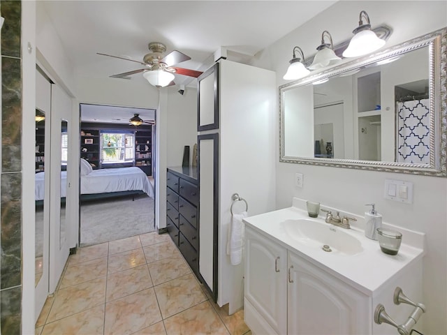 6106 Kittiwake Dr, Lakeland, FL 33809 - ensuite bathroom featuring tile patterned flooring, ensuite bath, vanity, and ceiling fan