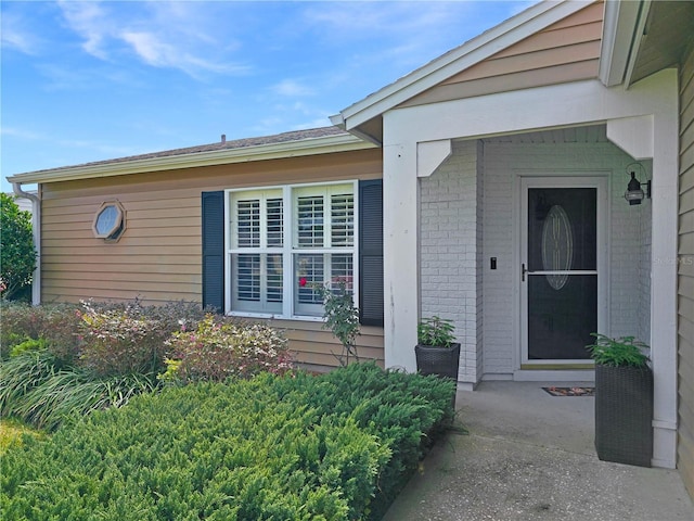 6106 Kittiwake Dr, Lakeland, FL 33809 - view of exterior entry with brick siding