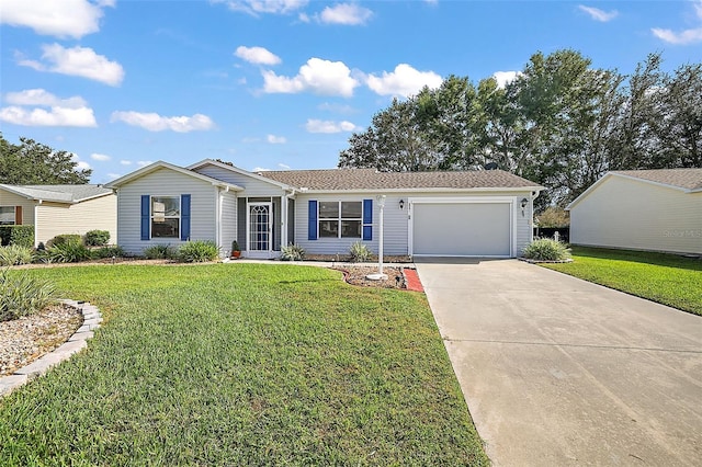 ranch-style house featuring driveway, a garage, and a front lawn