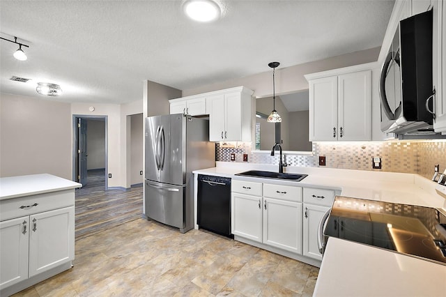 kitchen featuring black appliances, a sink, and light countertops