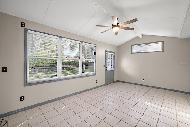 empty room featuring vaulted ceiling with beams, light tile patterned floors, ceiling fan, and baseboards