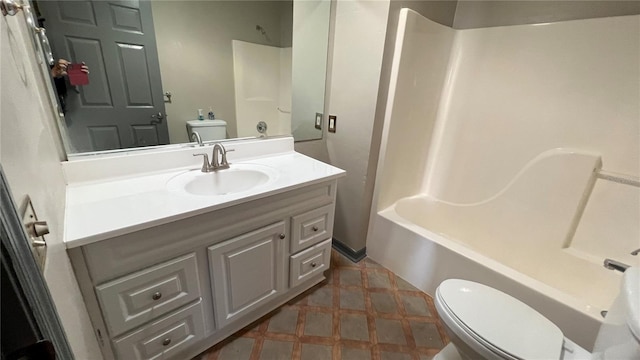 bathroom with shower / tub combination, vanity, and toilet