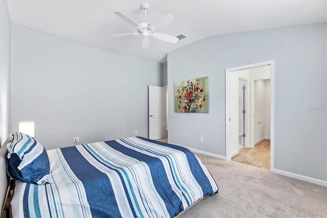 bedroom featuring vaulted ceiling, baseboards, visible vents, and light colored carpet