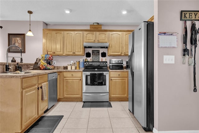 kitchen with appliances with stainless steel finishes, a peninsula, light brown cabinetry, under cabinet range hood, and a sink