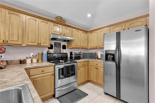 kitchen featuring appliances with stainless steel finishes, light countertops, under cabinet range hood, and light brown cabinets