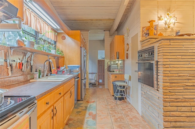 kitchen featuring stainless steel appliances, wooden ceiling, a sink, and light tile patterned floors