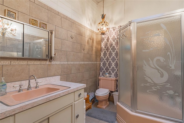 full bathroom with tile walls, toilet, a shower with shower door, tile patterned flooring, and backsplash