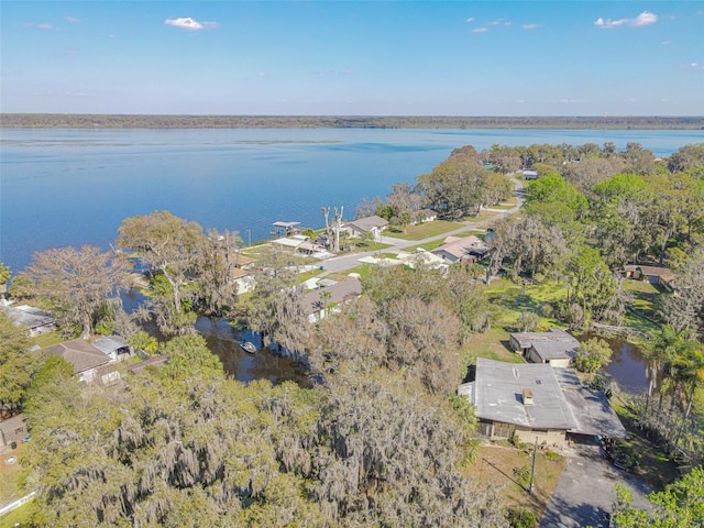 drone / aerial view featuring a water view and a residential view