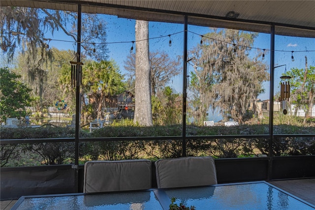 unfurnished sunroom with plenty of natural light