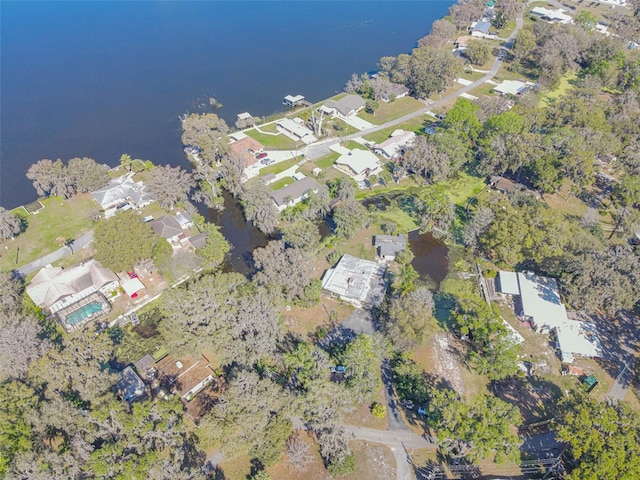 bird's eye view featuring a water view and a residential view