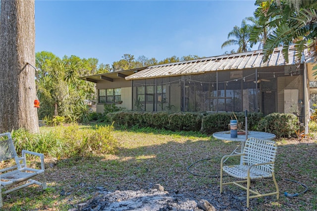 view of yard featuring a sunroom