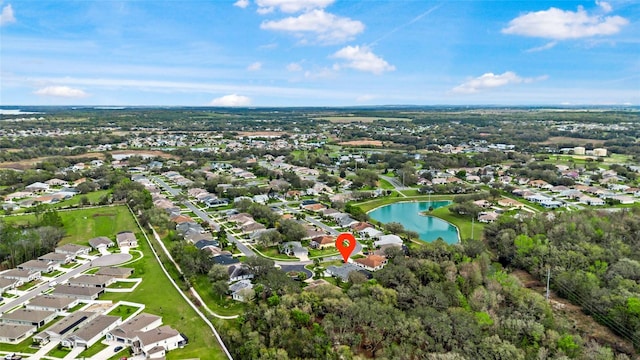 bird's eye view featuring a water view and a residential view