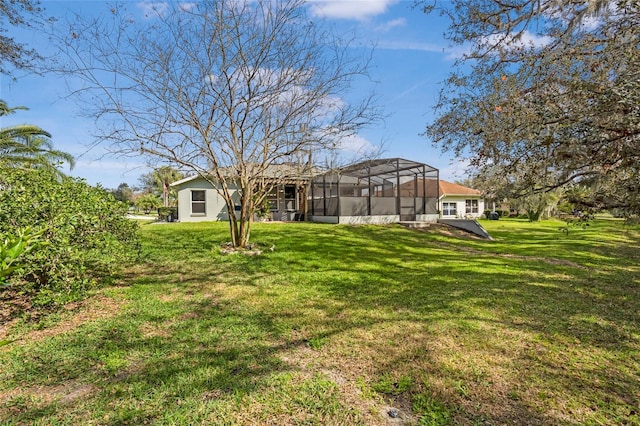 view of yard with glass enclosure