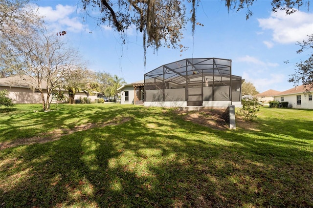 view of yard featuring glass enclosure