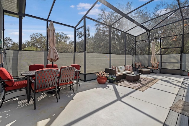 view of patio / terrace with glass enclosure, outdoor dining space, and an outdoor living space with a fire pit