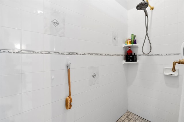 full bathroom with tiled shower