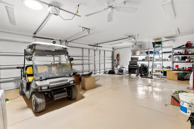 garage with a ceiling fan and a garage door opener