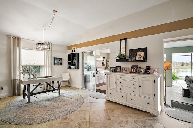 dining room featuring vaulted ceiling, baseboards, and an inviting chandelier