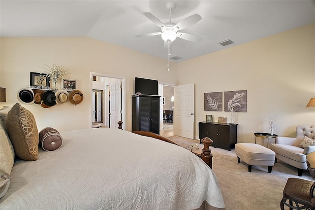 bedroom featuring carpet floors, visible vents, vaulted ceiling, and ceiling fan