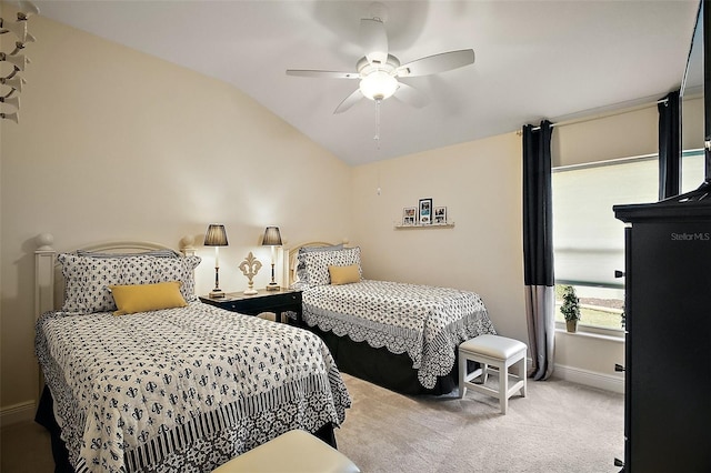 bedroom featuring lofted ceiling, ceiling fan, baseboards, and light colored carpet