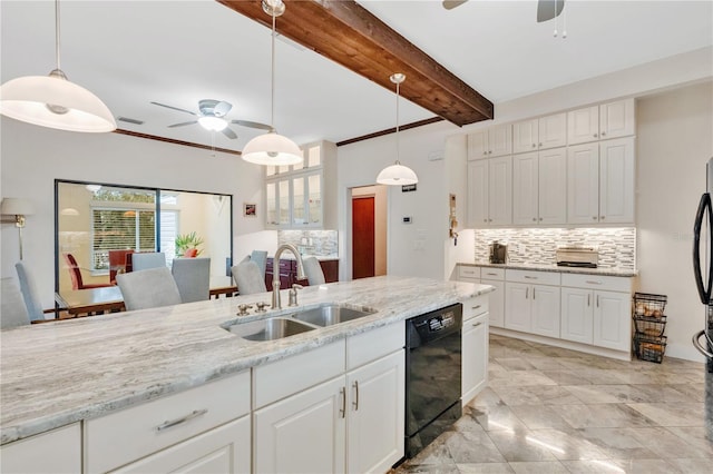 kitchen with black dishwasher, hanging light fixtures, a sink, white cabinetry, and backsplash