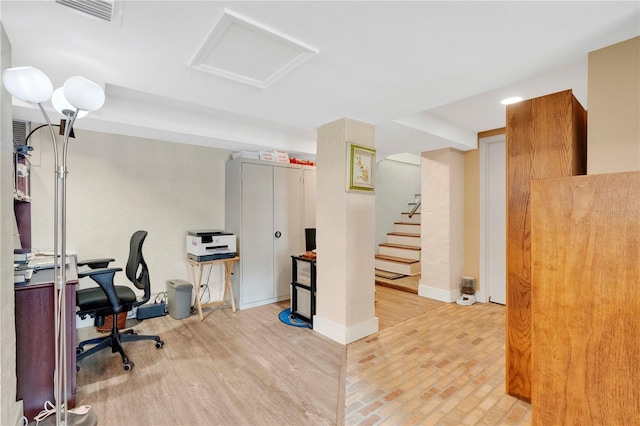 office featuring visible vents and attic access