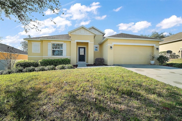 view of front of property with an attached garage, driveway, a front yard, and stucco siding