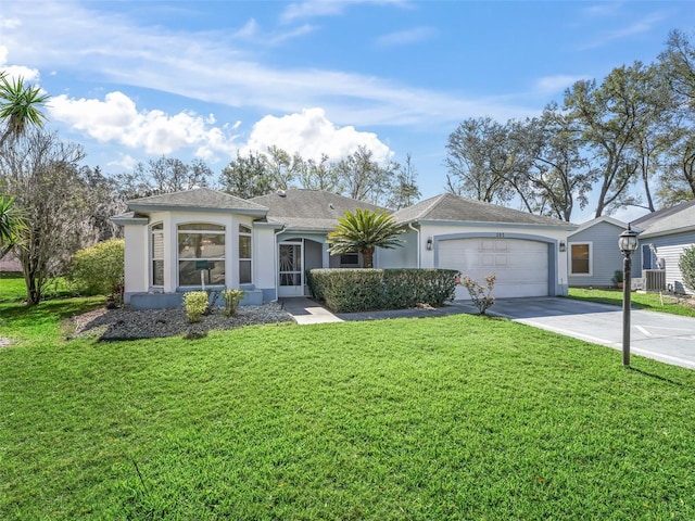 view of front of property featuring a shingled roof, concrete driveway, an attached garage, a front lawn, and stucco siding