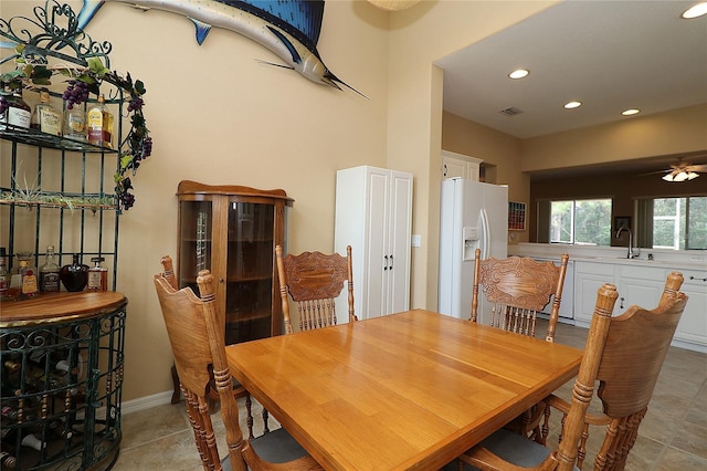 dining space featuring baseboards, light tile patterned flooring, visible vents, and recessed lighting