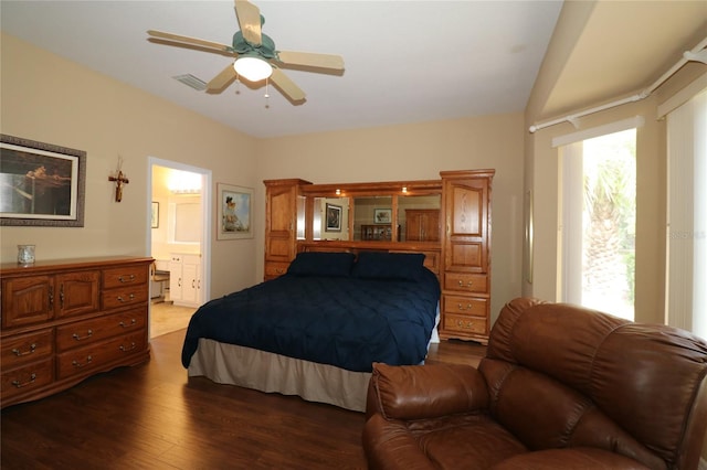 bedroom with ceiling fan, visible vents, dark wood finished floors, and ensuite bathroom