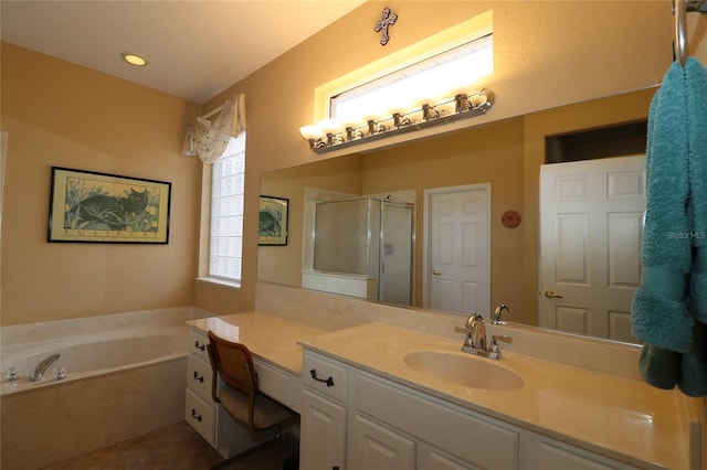 bathroom featuring a garden tub, a shower stall, vanity, and tile patterned floors