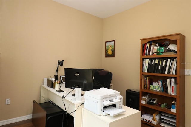 office space with baseboards