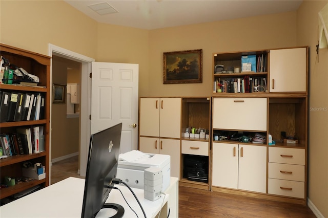 office space with wood finished floors