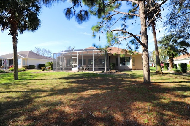 view of yard featuring glass enclosure