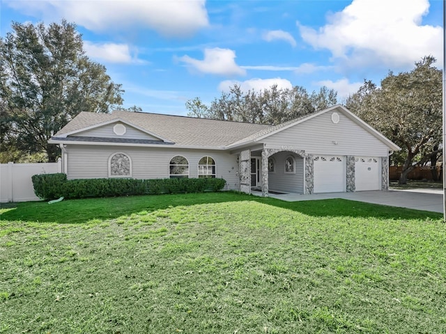 ranch-style house with a shingled roof, an attached garage, fence, driveway, and a front lawn