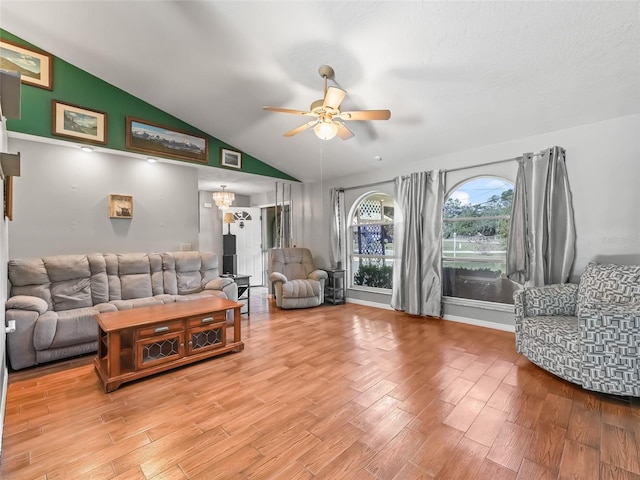 living room with lofted ceiling, light wood-style flooring, and ceiling fan